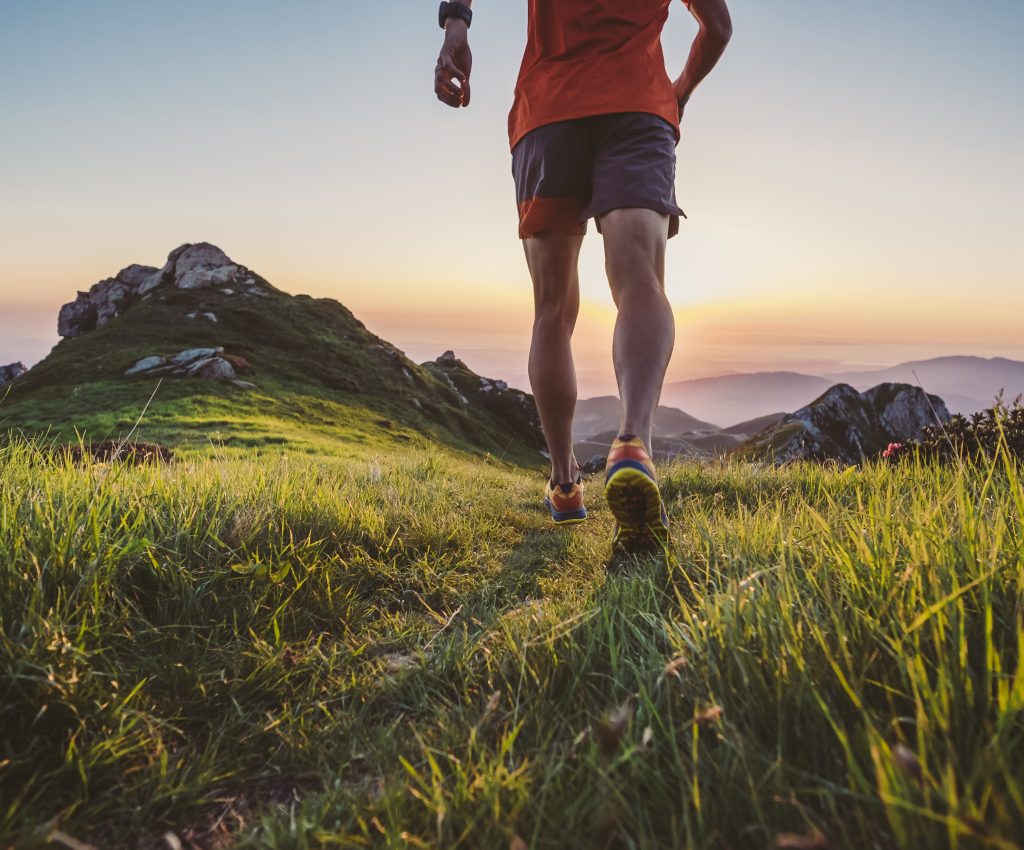 Man Trail Running On A Mountain At The Dask